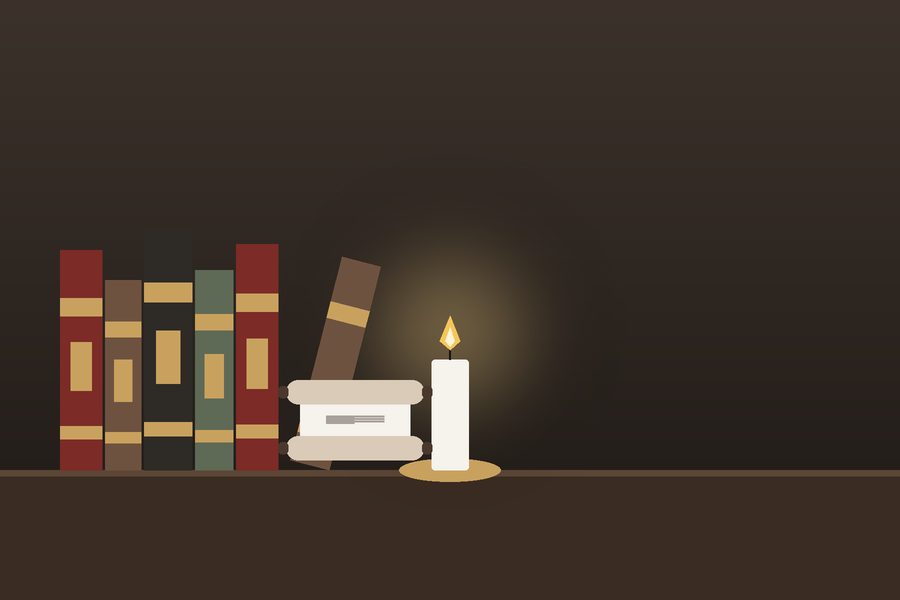 كتبٌ قديمة بأغلفةٍ جلديّة وشمعة