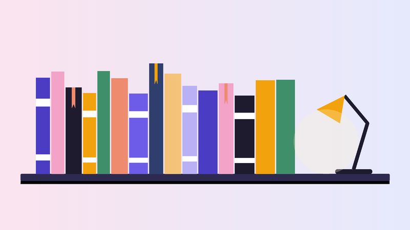 رفٌّ طويل من الكتب بعلاماتٍ ملوّنة