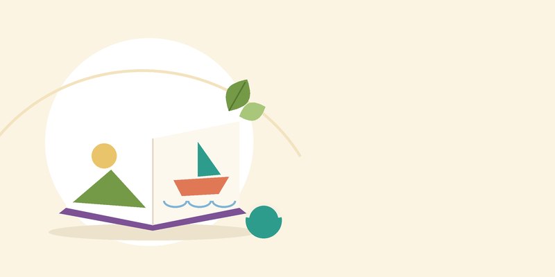 كتابٌ مصوّر مفتوح للصغار بجانبه كرة